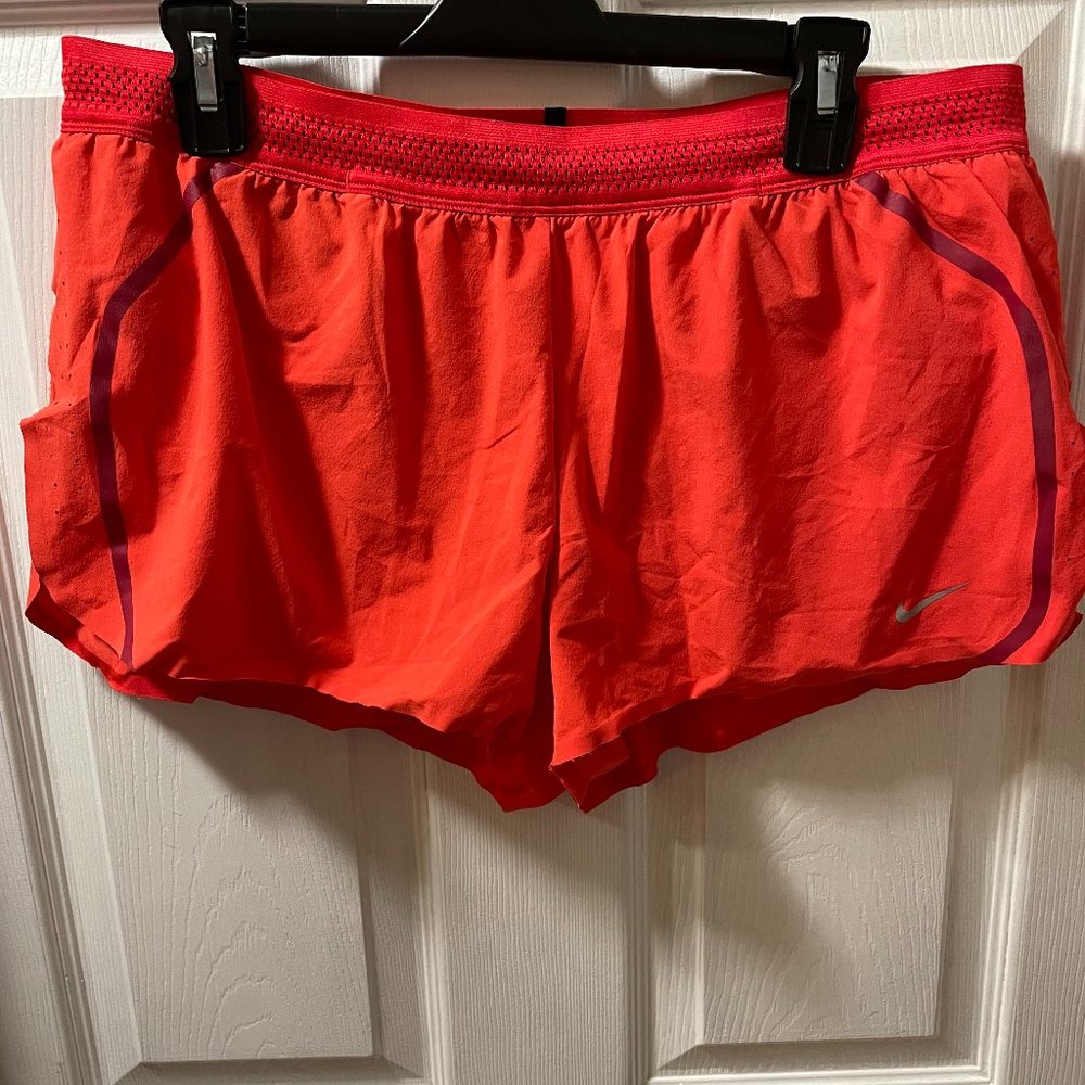 Nike bright orange athletic shorts